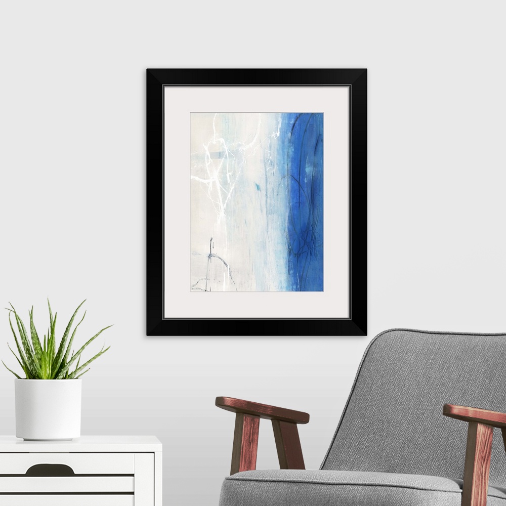 A modern room featuring Contemporary abstract painting using white and vibrant blue in vertical formation.