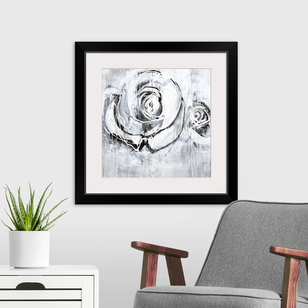 A modern room featuring Square artwork of two roses in textured paint on shades of gray.