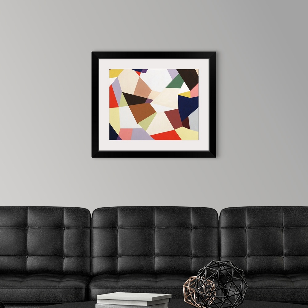 A modern room featuring Large abstract painting created with geometric shapes fitting together in various colors.