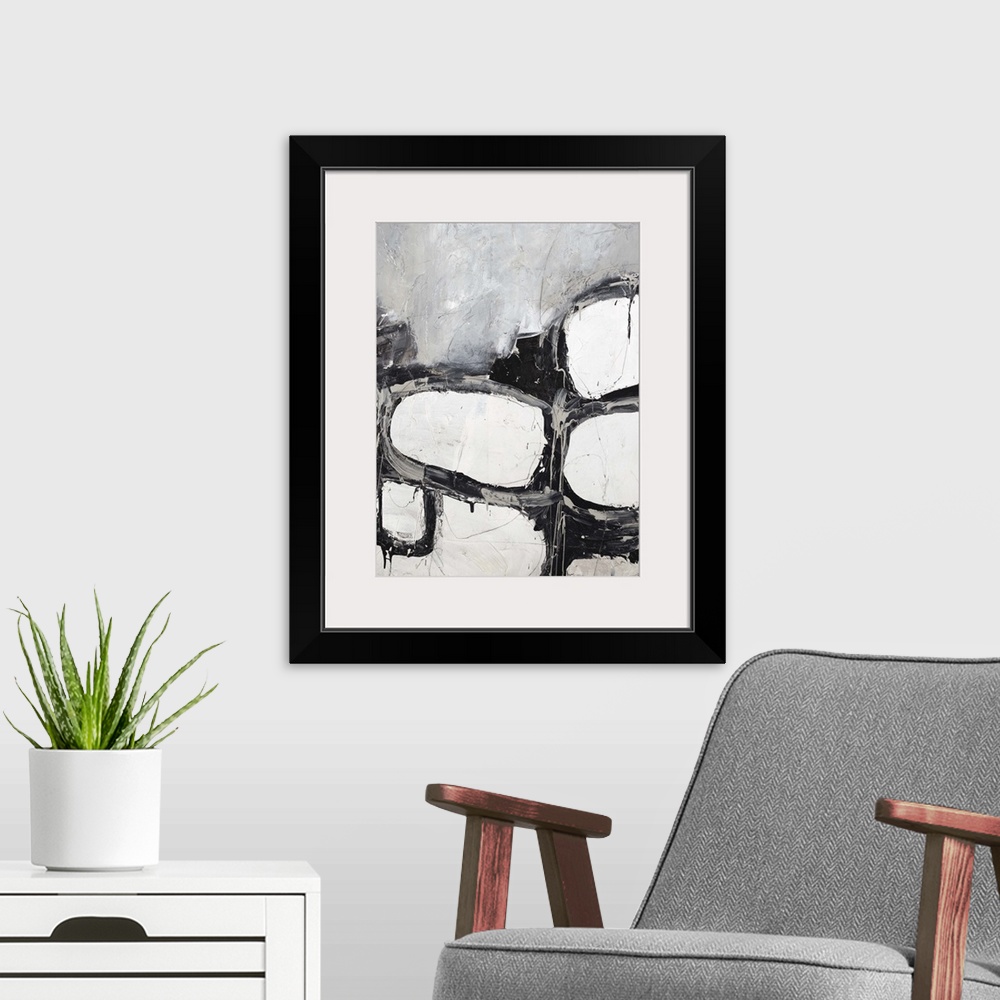 A modern room featuring Contemporary abstract painting in shades of black and white.