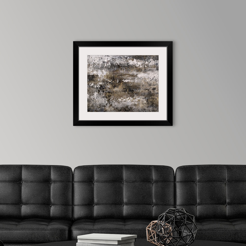 A modern room featuring Abstract painting using textured looking gray tones to form what almost appears as a landscape.