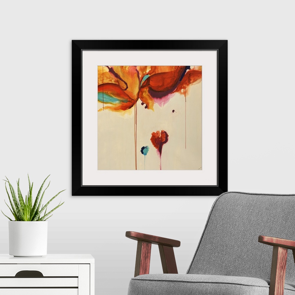 A modern room featuring Square contemporary abstract painting of warm color blobs with color dripping down from them.