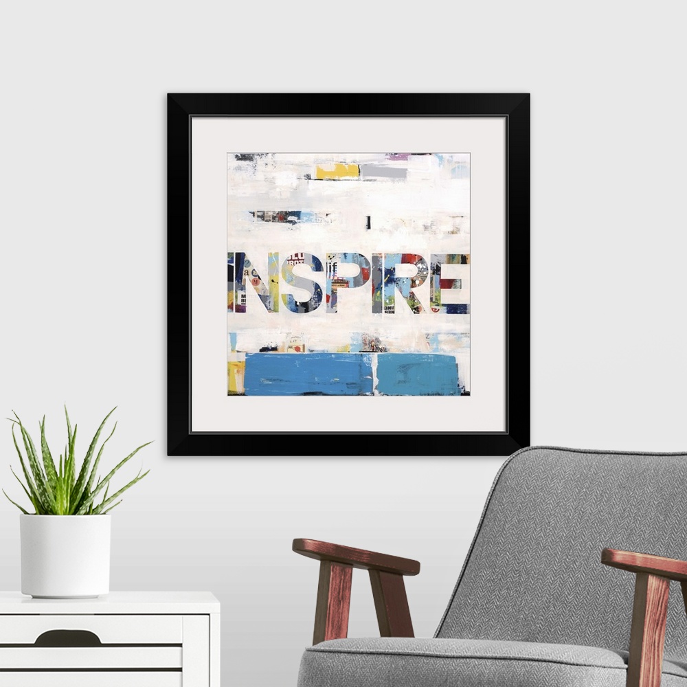 A modern room featuring Collage-style artwork of the word "inspire" in large block letters.
