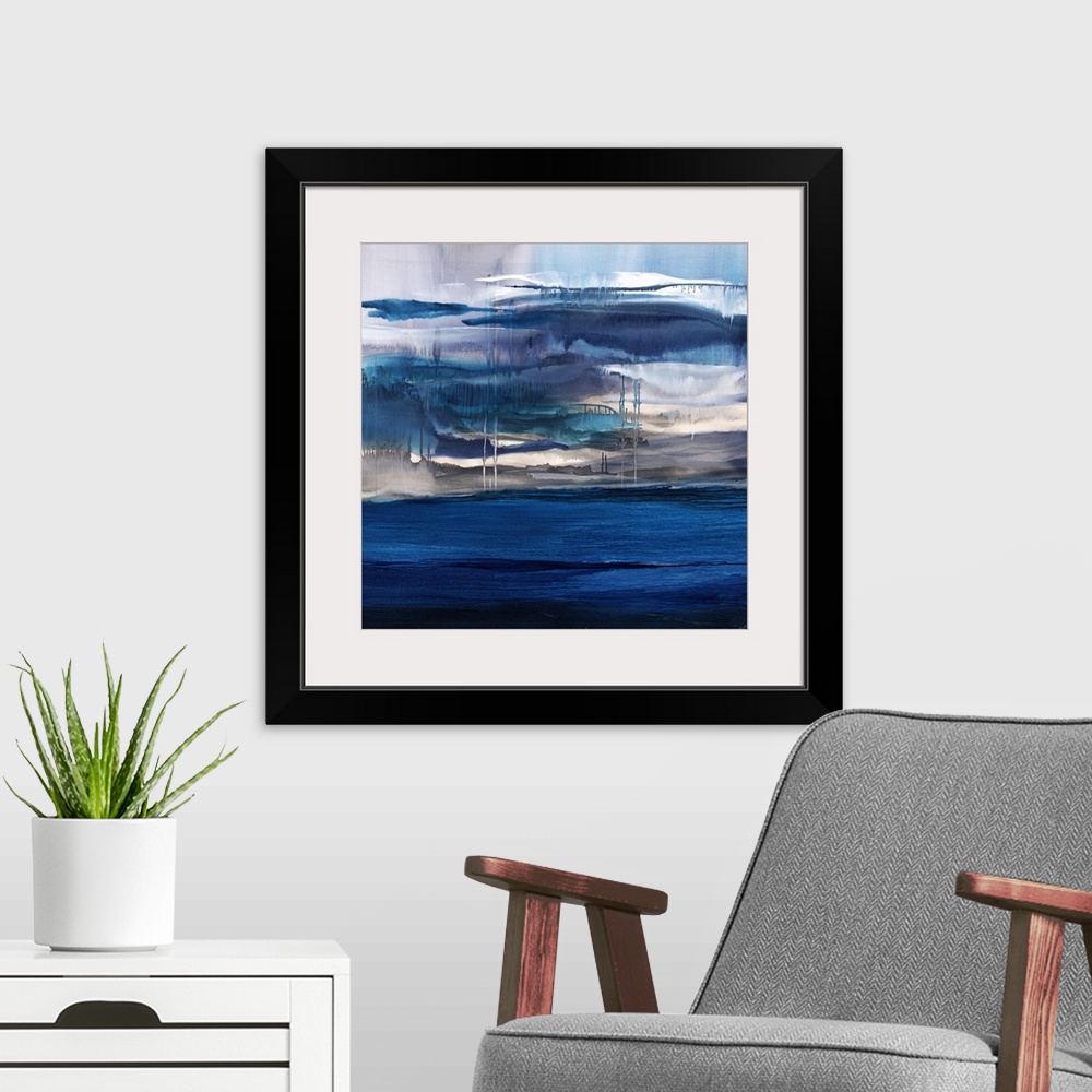 A modern room featuring Square abstract painting with shades of blue layered on top of each other and dripping towards th...
