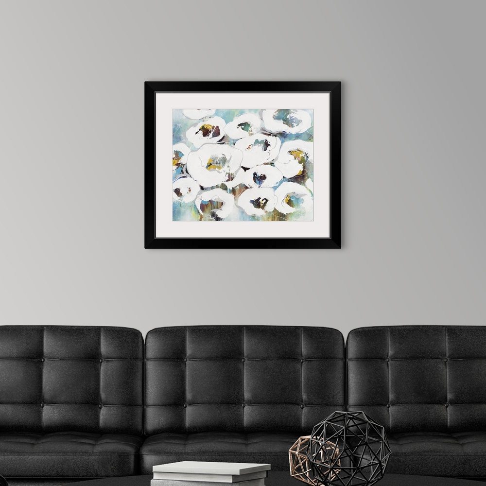 A modern room featuring An abstract floral painting of white flowers with a multi-color background.