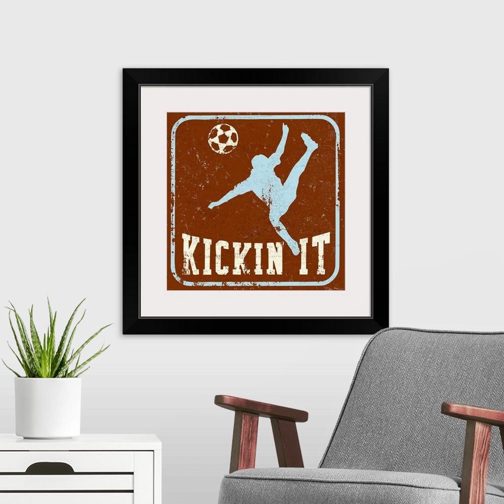 A modern room featuring Distressed image of soccer player kicking a soccer ball with the words Kickin' It underneath.