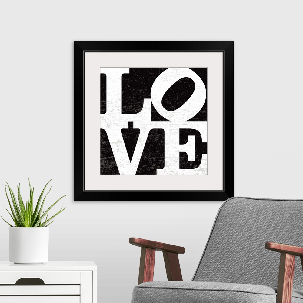 A modern room featuring A LOVE graphic with bold and distressed typography in black.