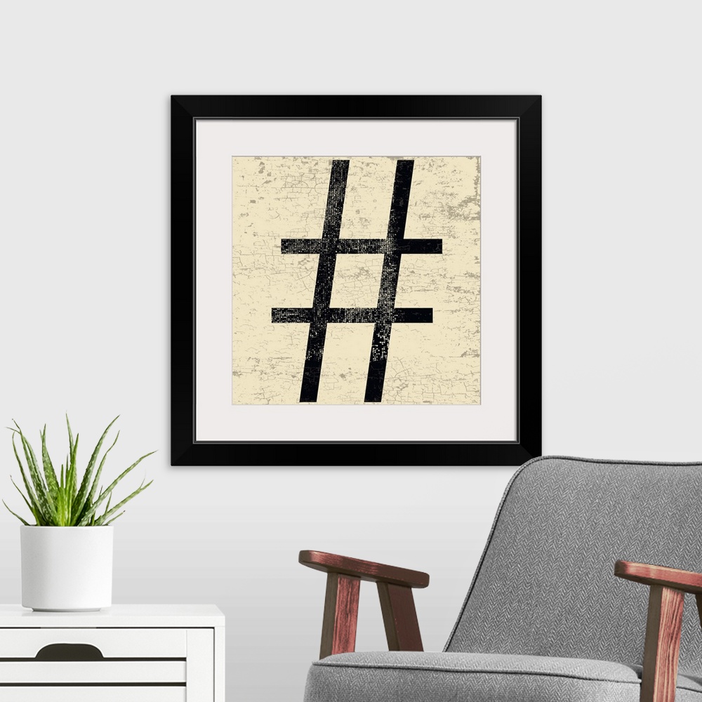 A modern room featuring Distressed typography wall art of a large black hashtag character on a tan and sepia background.