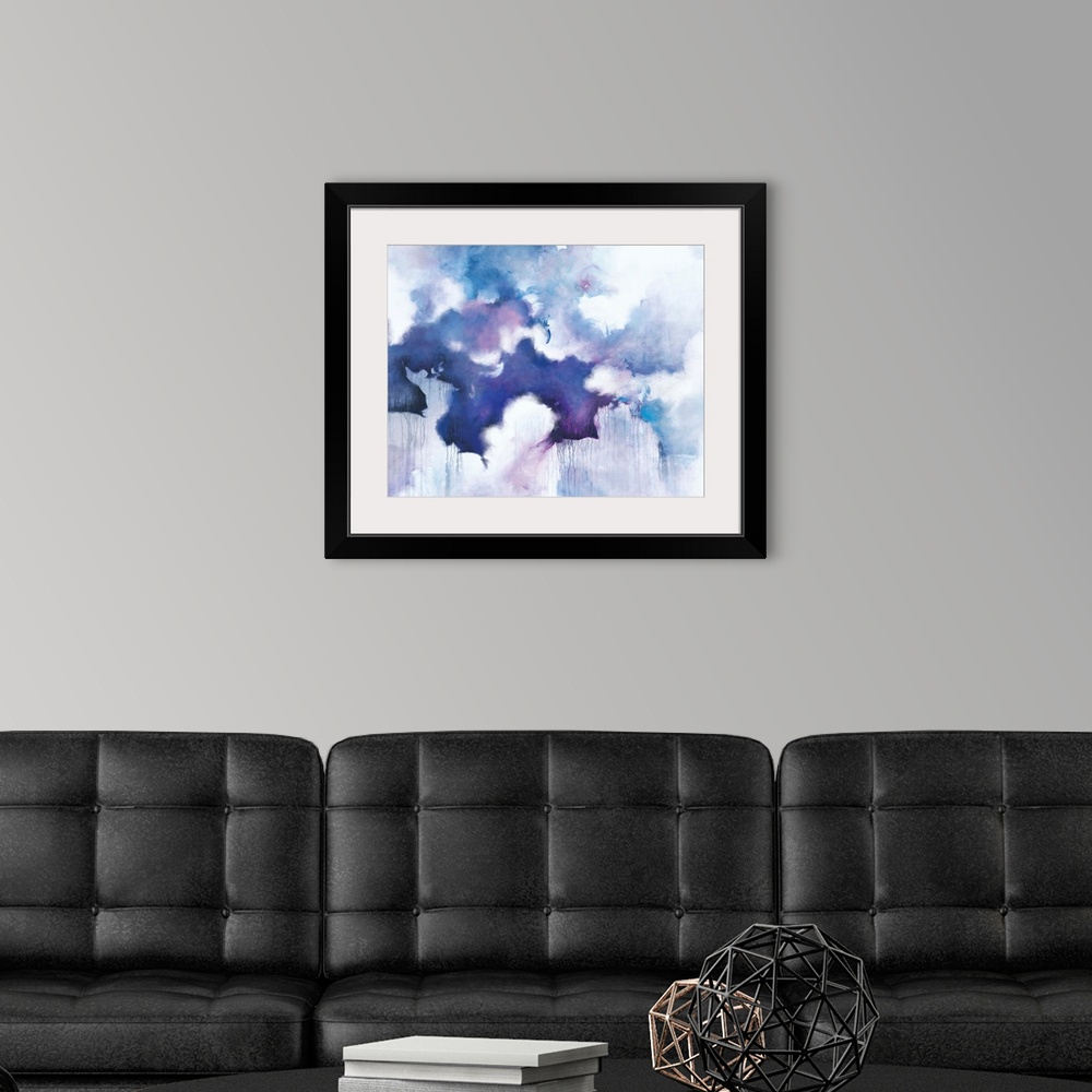A modern room featuring Abstract contemporary painting in blue and purple tones, resembling a cloudy sky.