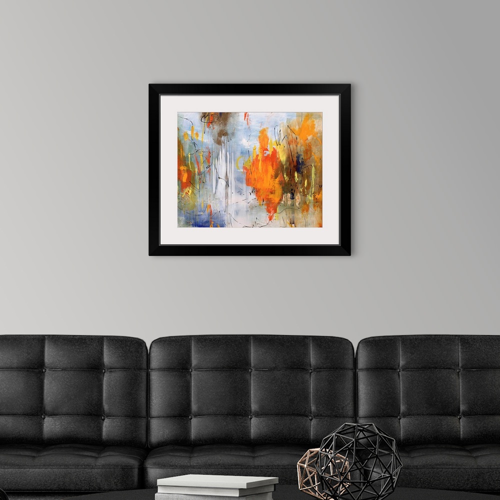 A modern room featuring Abstract painting of bright colors mixed with earth tones to create depth.