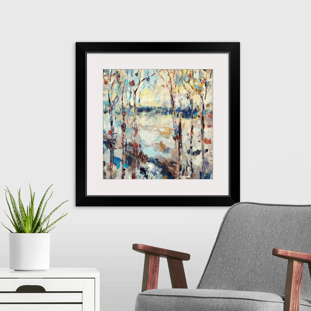 A modern room featuring A dramatic abstract painting of a path through a forest on square shaped wall art.