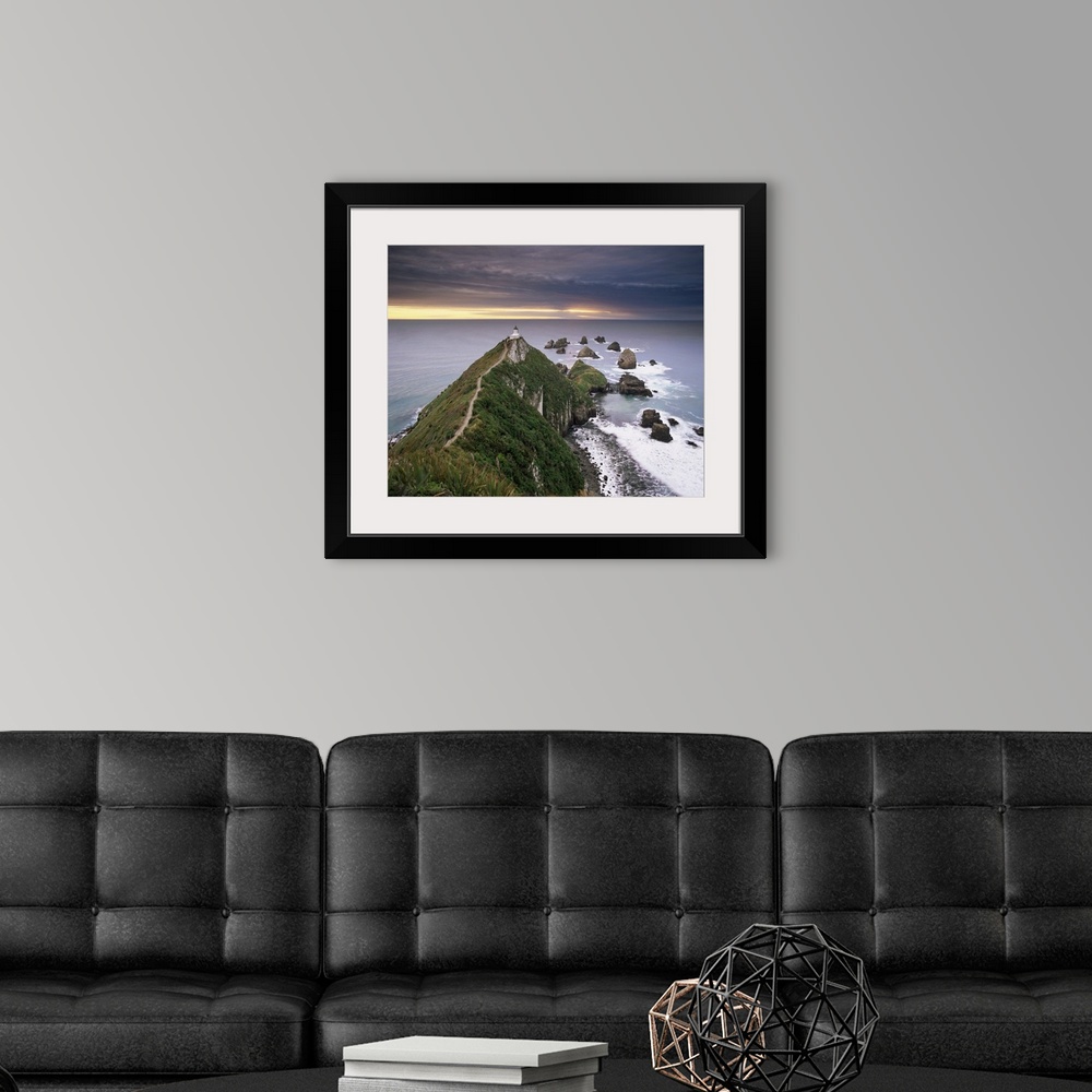 A modern room featuring Nugget Point lighthouse on the coast and overcast sky, the Catlins, New Zealand