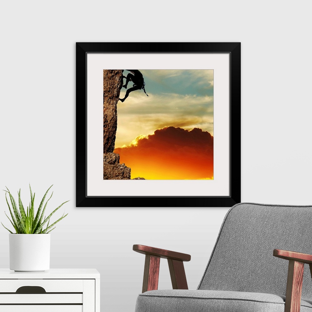 A modern room featuring girl climbing on the rock on sunset background