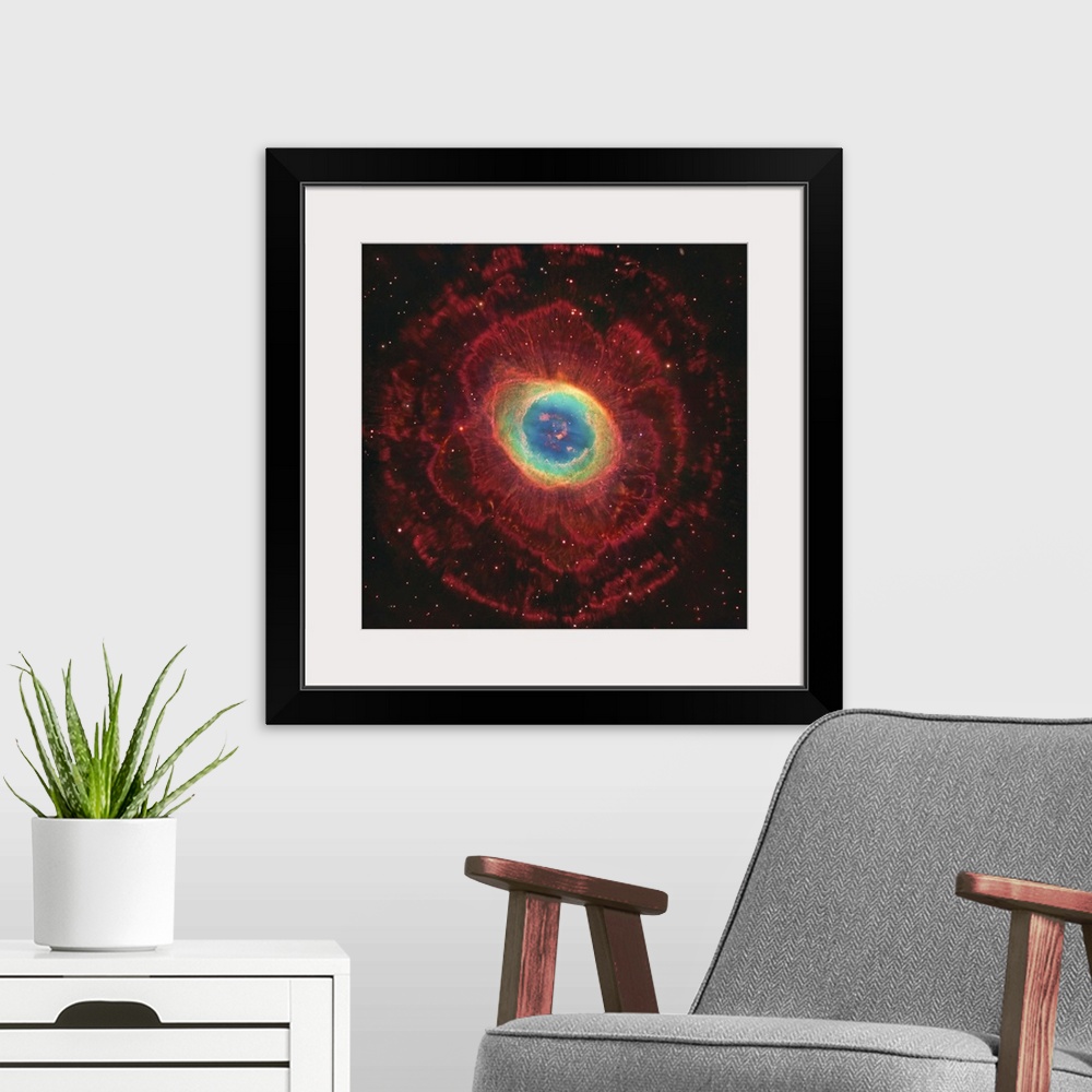 A modern room featuring M57, The Ring Nebula. The inner shell glows green from ionized oxygen and nitrogen while hydrogen...