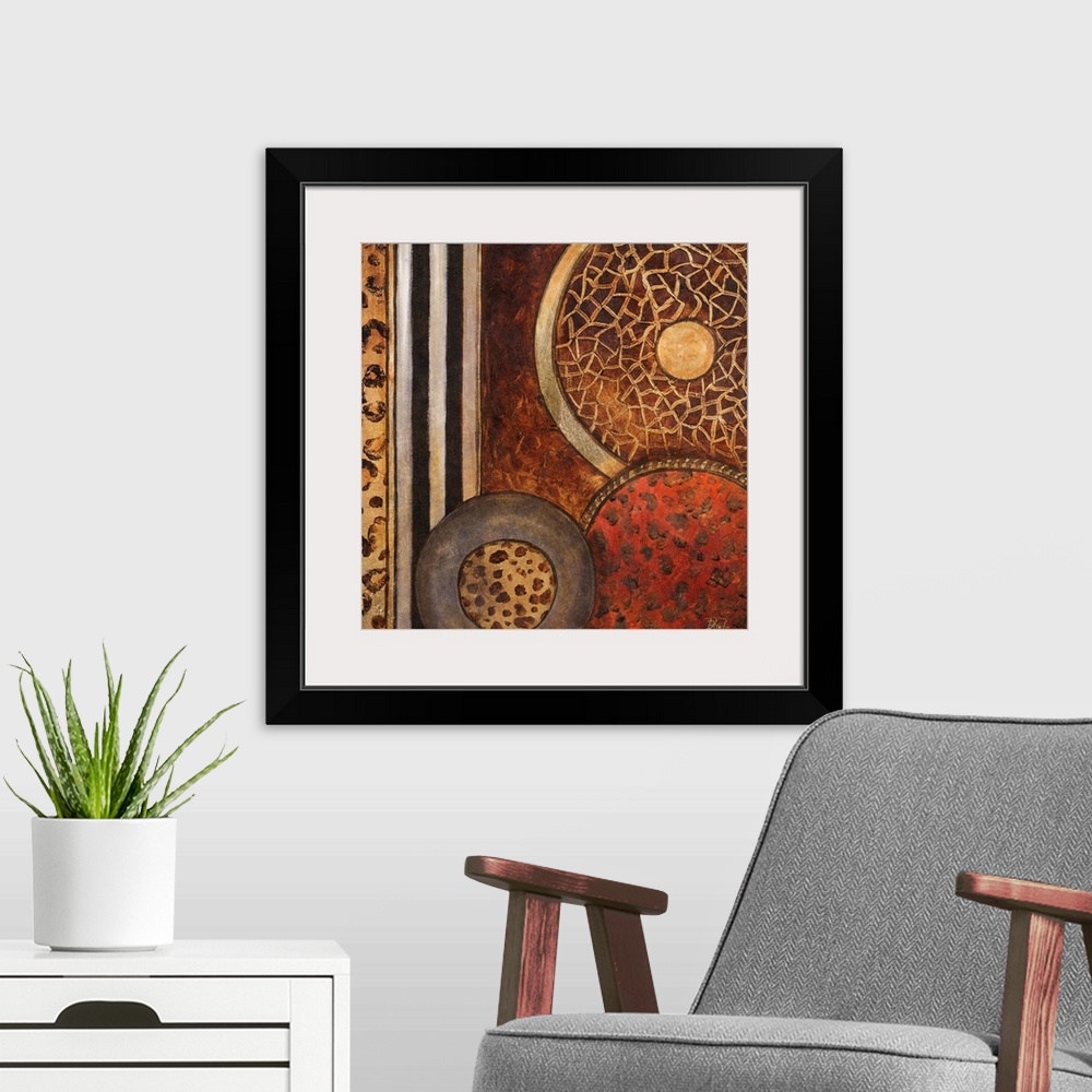 A modern room featuring Abstract artwork that consists of three circles each filled with a different animal pattern. Stri...