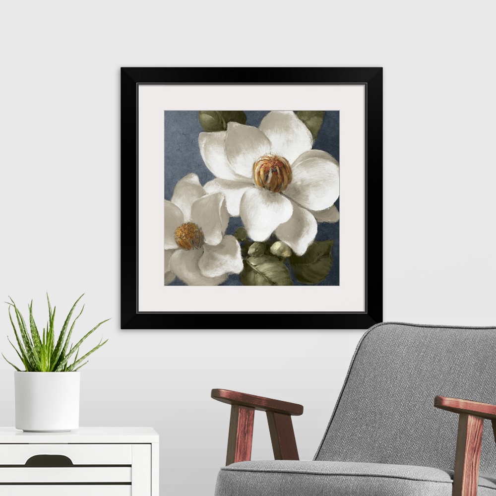 A modern room featuring Square floral painting of two fully bloomed magnolia flowers, surrounded by leaves, on a grey blu...
