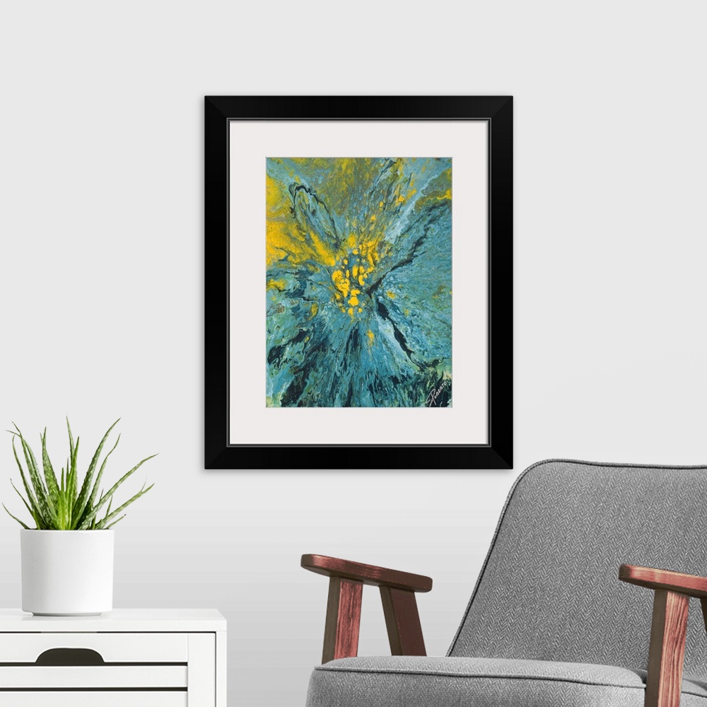 A modern room featuring Abstract painting that depicts a blue and yellow paint explosion on to canvas.