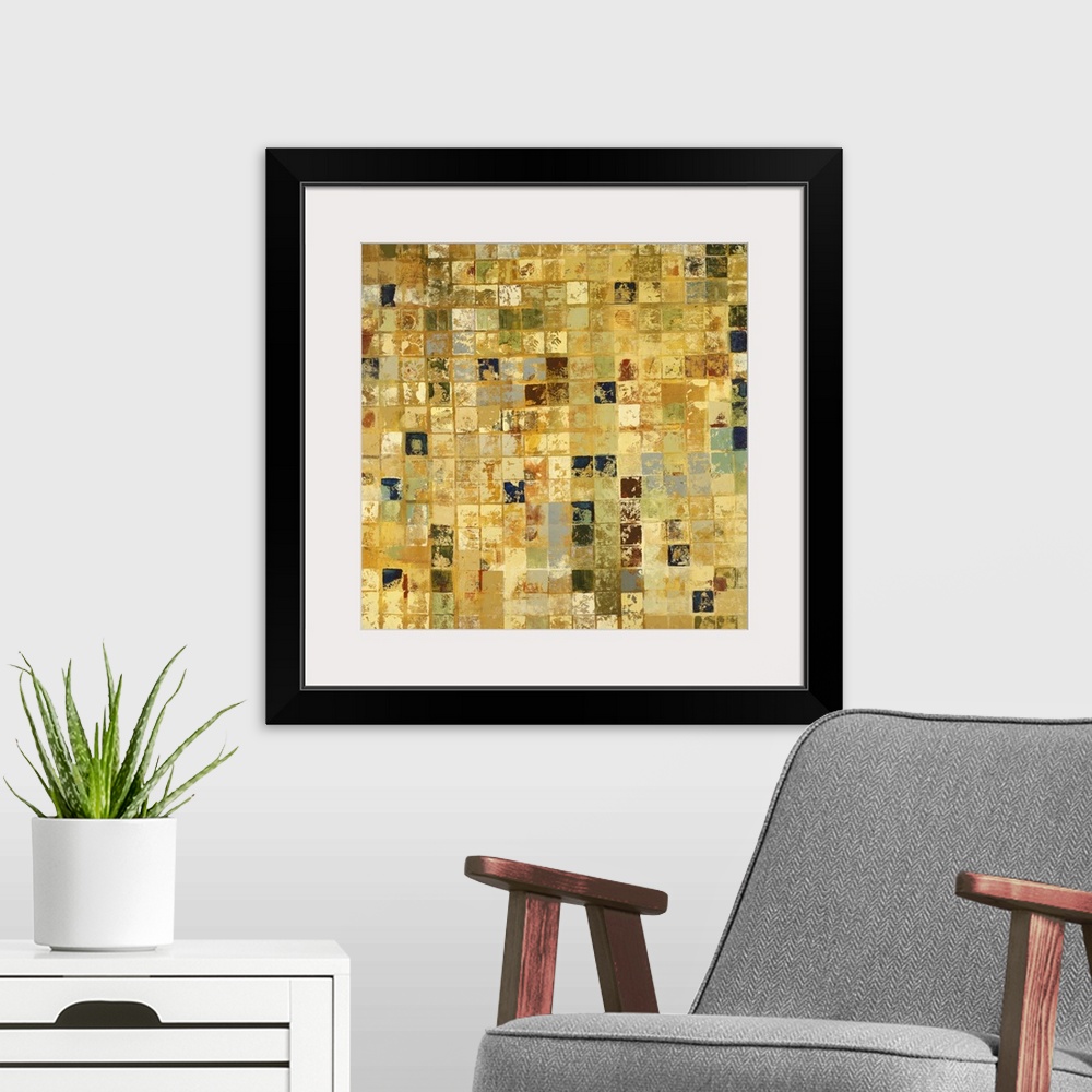 A modern room featuring Home decor artwork of a gold and earth toned mosaic.