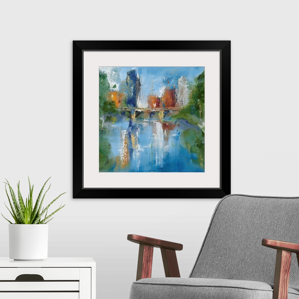 A modern room featuring Square abstract painting of a city skyline and a bridge reflecting into water with trees on the s...