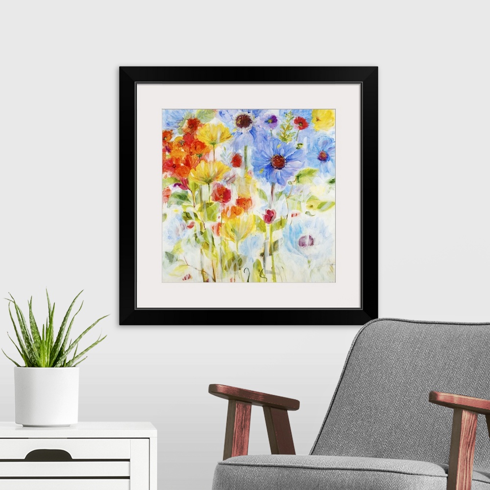 A modern room featuring Contemporary painting of vibrant blue yellow and red flowers.