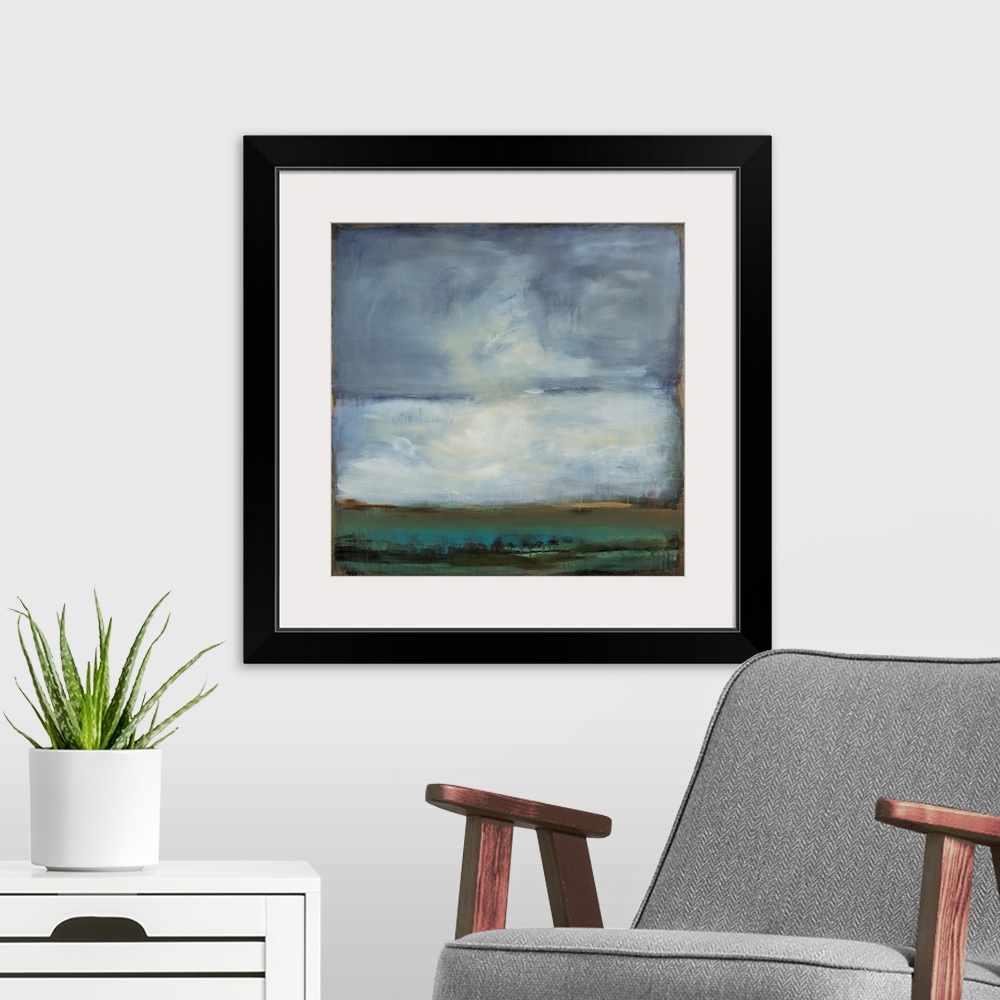 A modern room featuring Square abstract painting of a landscape with blue, green, and black hues and a gold boarder and l...