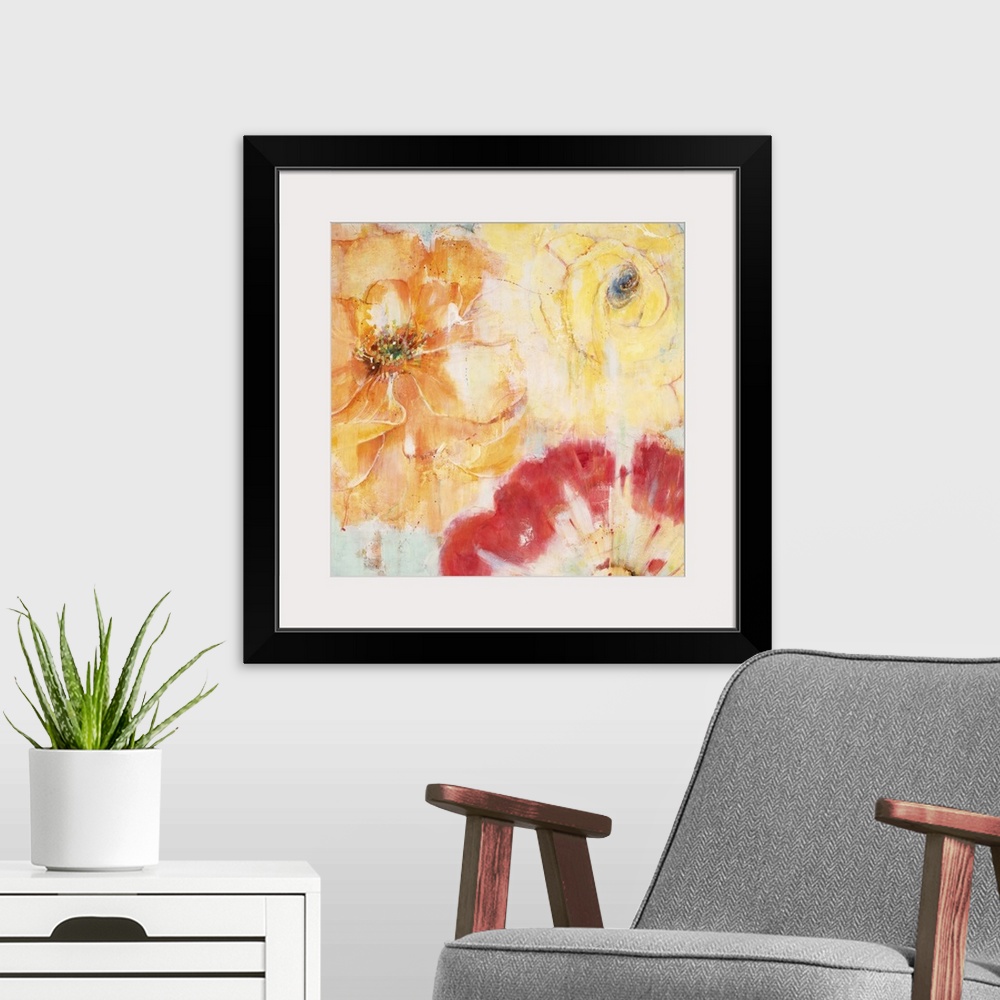 A modern room featuring Contemporary painting of vibrant red orange and yellow flowers close-up.