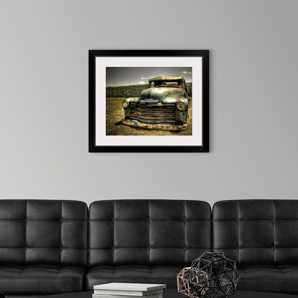 A modern room featuring A photo on canvas of a vintage Chevrolet truck parked in front of a corn field.