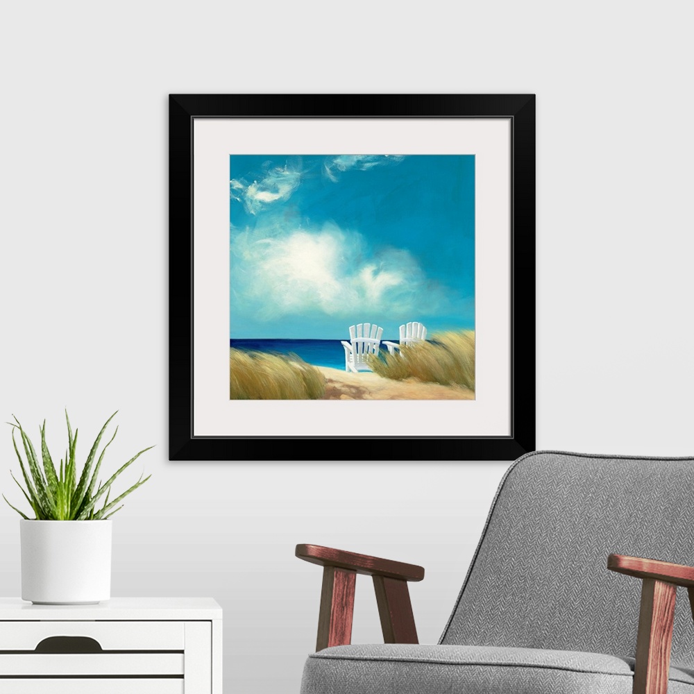 A modern room featuring Giant, square wall painting of a sandy path leading through a grassy beach to two lounge chairs t...
