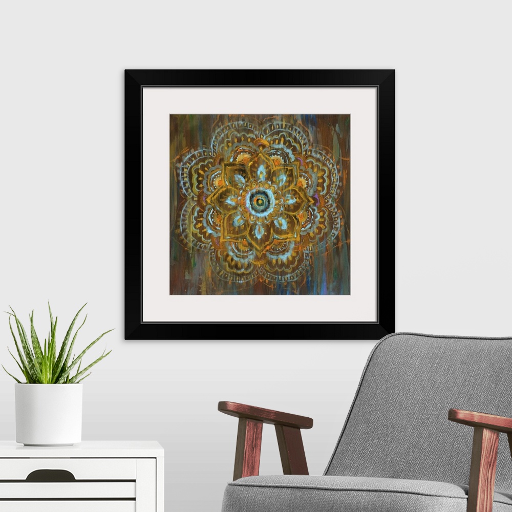 A modern room featuring Square abstract painting of a flower mandala with blue, orange, yellow, and brown hues and hints ...