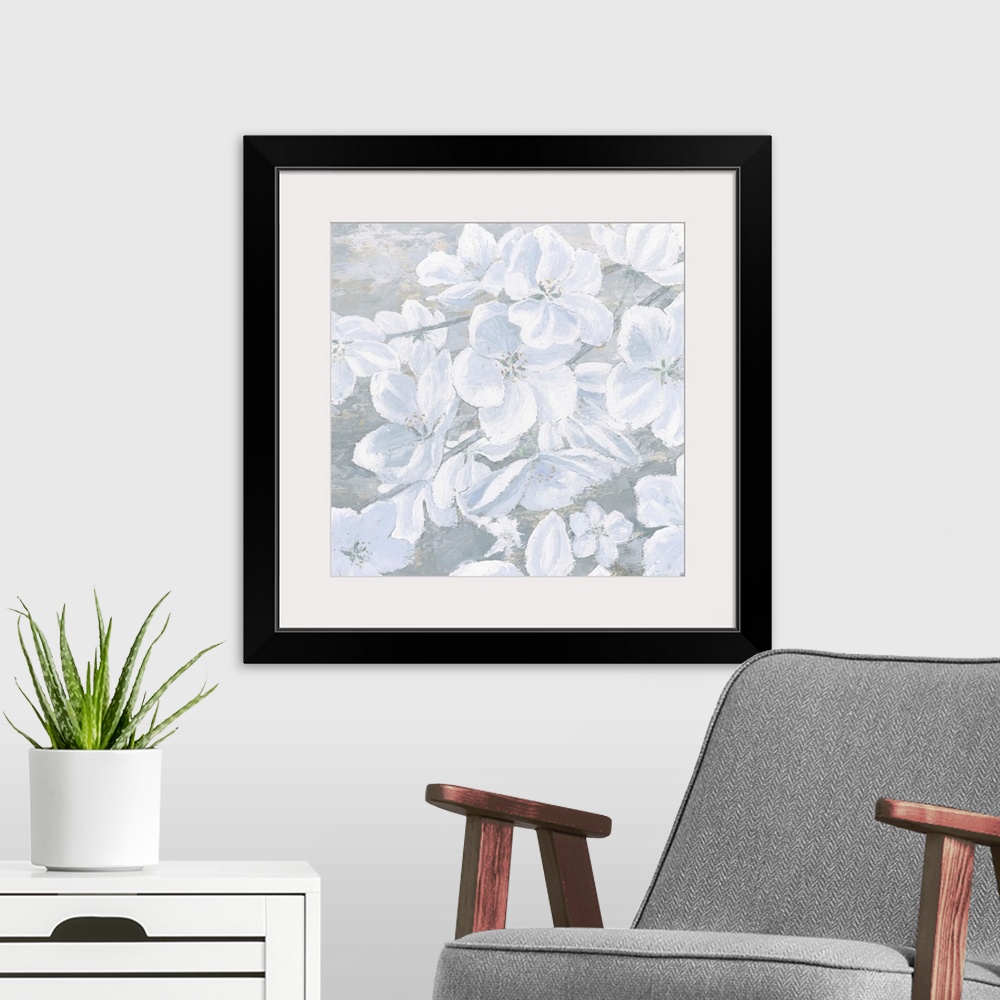 A modern room featuring Square painting of cool toned white flowers on a slate blue and grey background.