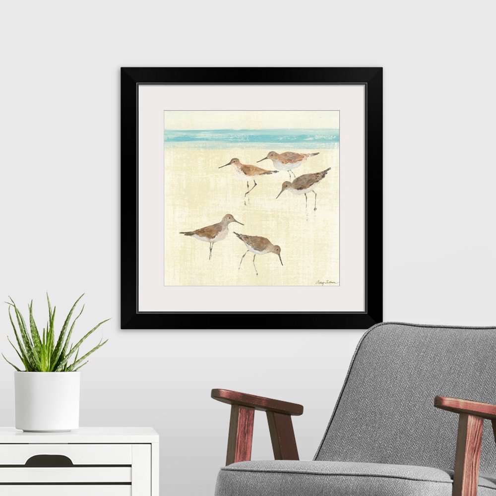 A modern room featuring Square painting of ocean birds walking on the sand of a beach with the sea in the distance.