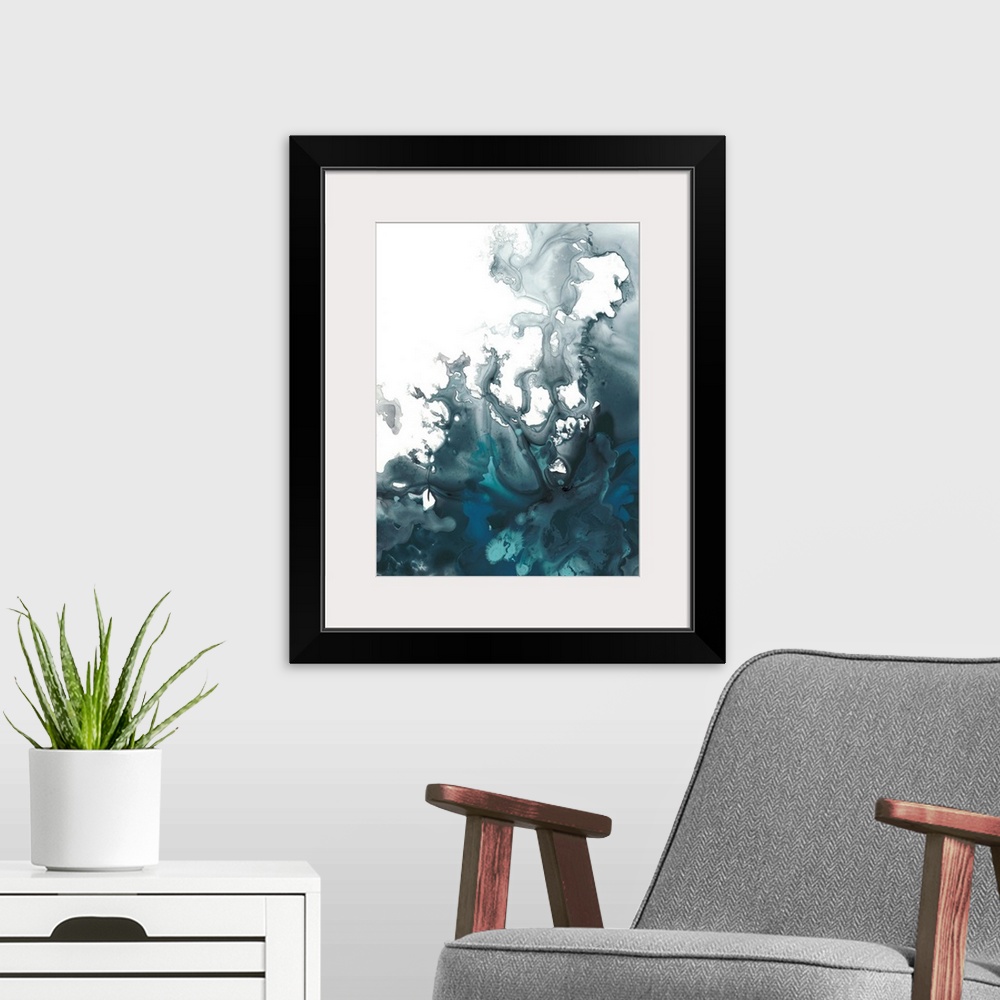 A modern room featuring Abstract artwork with indigo hues marbling together creating movement on a white background.