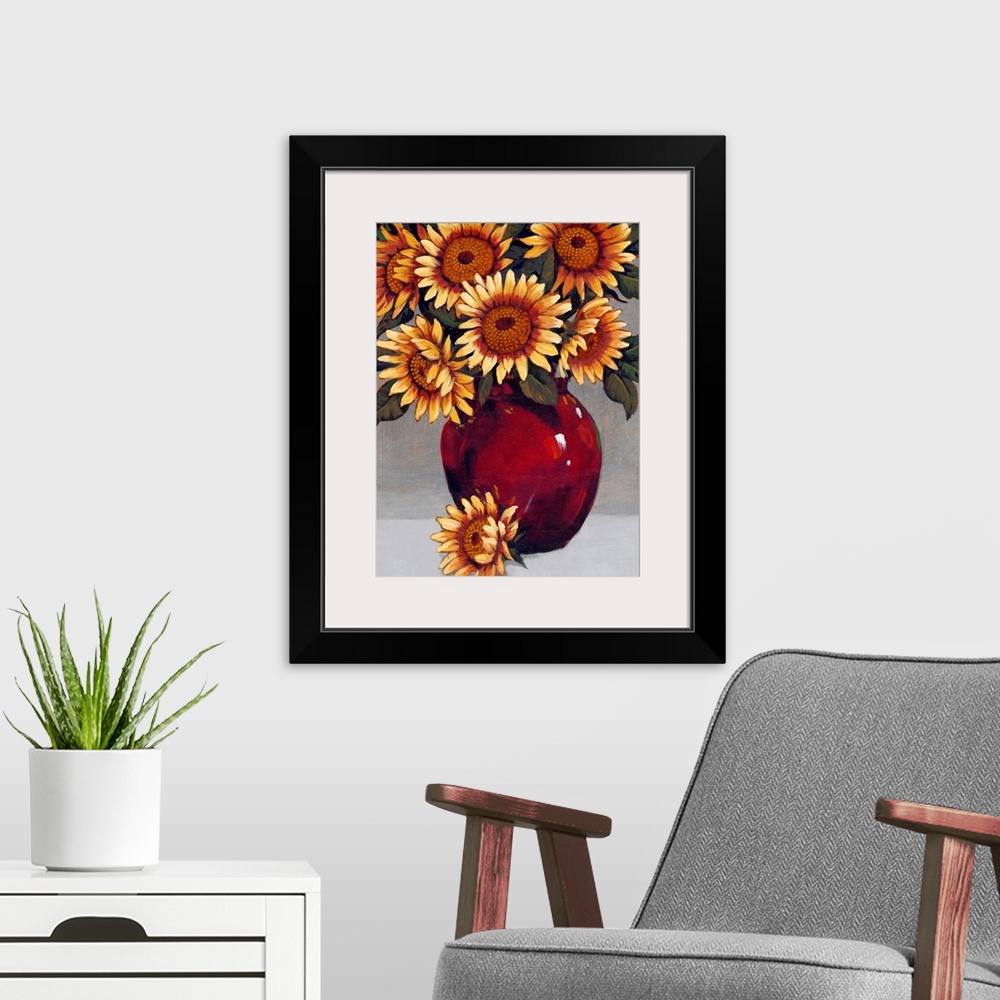 A modern room featuring A painting of vibrant yellow sunflowers sitting in a deep red vase against a gray background.