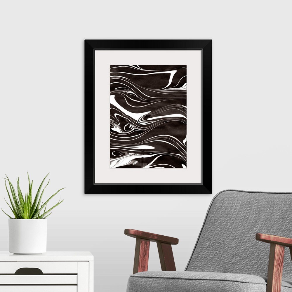 A modern room featuring Abstract artwork of black and white paint swirled around in rippling patterns.