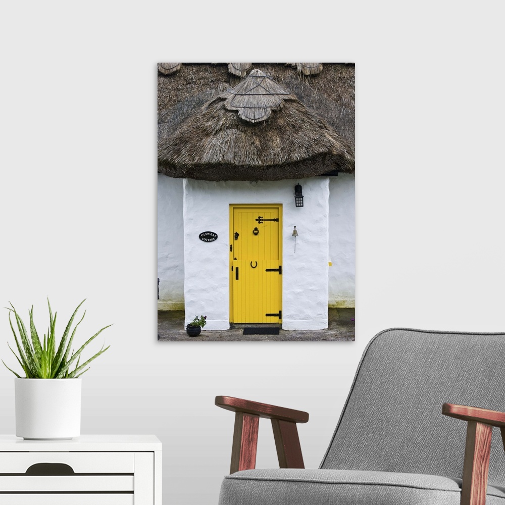 A modern room featuring Ireland, Achill Island. Yellow doorway on a thatch roof cottage.