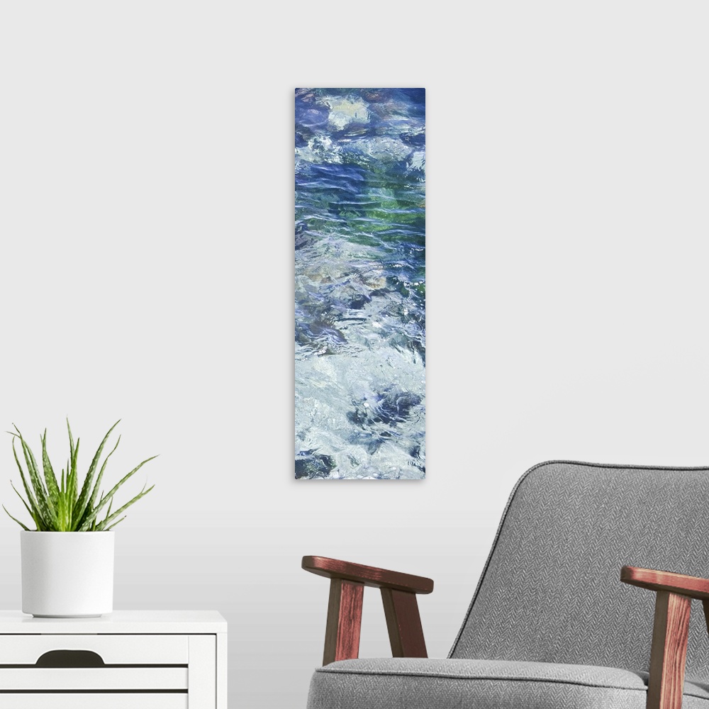 A modern room featuring Tall photograph of crystal clear blue water with ripples.