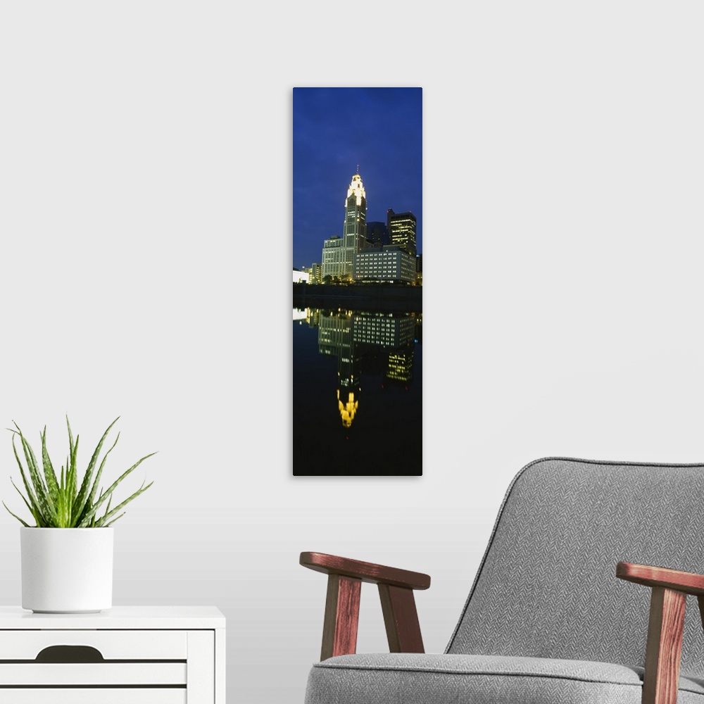 A modern room featuring Buildings in a city lit up at night, Scioto River, Columbus, Ohio