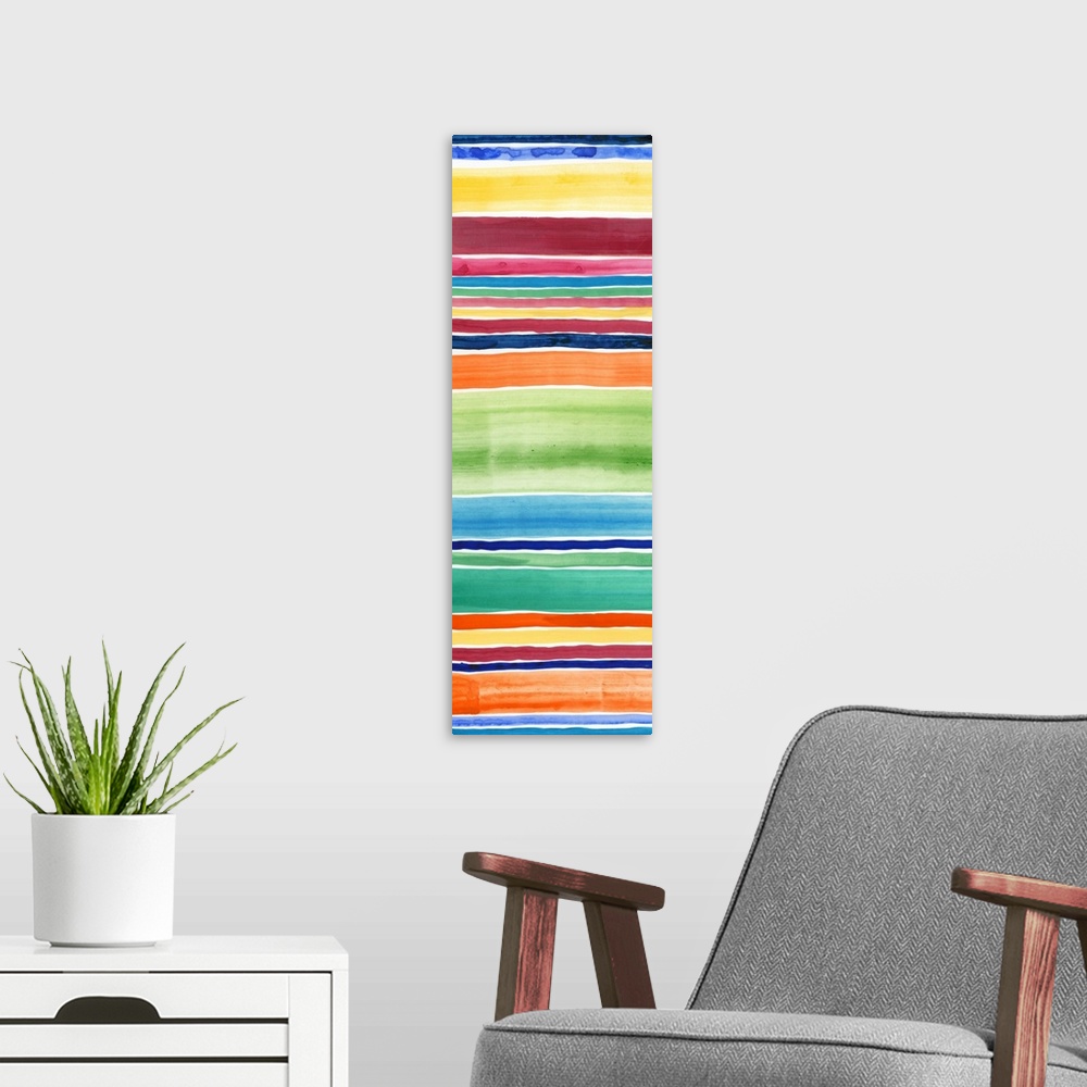 A modern room featuring Abstract art print of horizontal stripes in tropical rainbow colors.