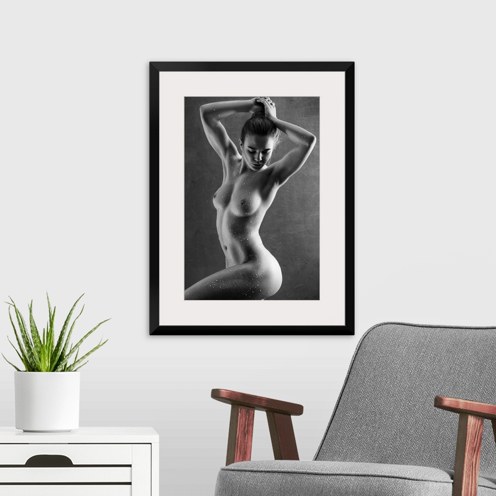 A modern room featuring Elegant black and white fine art photograph of a nude woman posing with water drops all over her ...