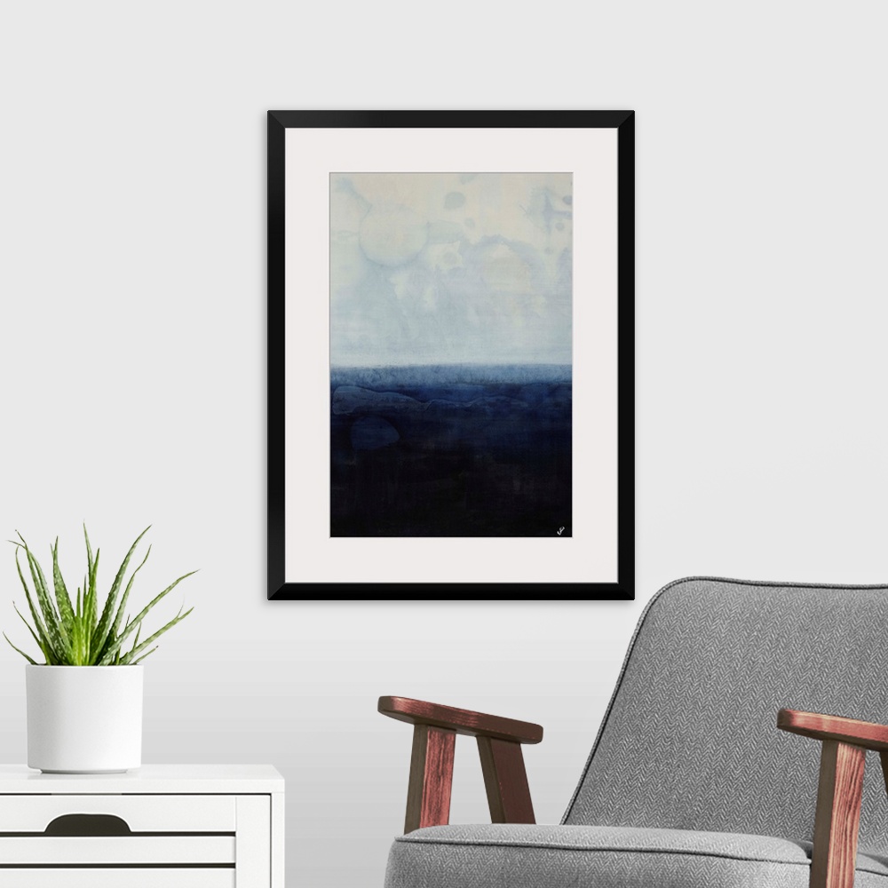 A modern room featuring Simplistic abstracted seascape of a field of gray-blue overtop a field of navy.