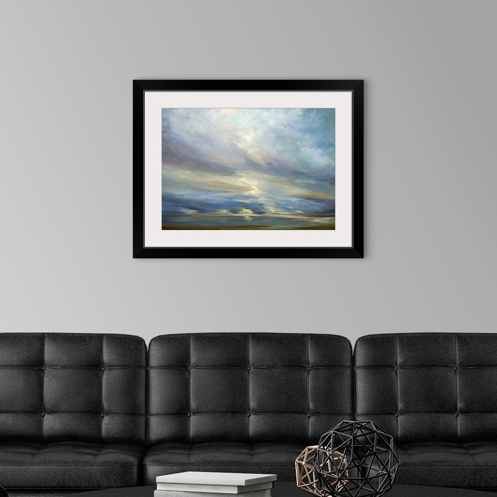 A modern room featuring Contemporary seascape painting of sunlight shining though clouds over the ocean.