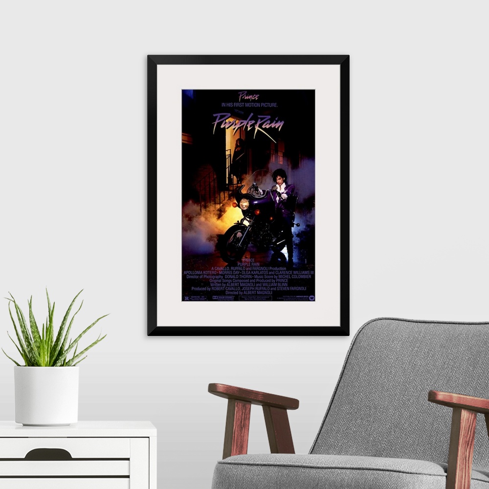A modern room featuring Vintage movie poster for the movie Purple Rain featuring the music artist Prince with a picture o...