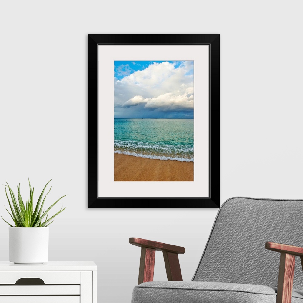 A modern room featuring This photograph is taken on a beach in Hawaii of immense clouds that hang in the sky over a teal ...