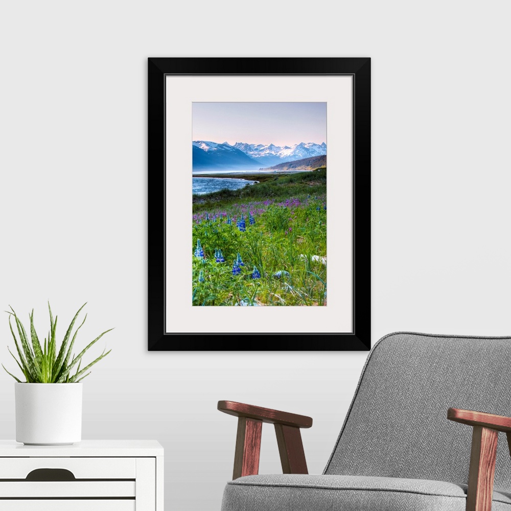 A modern room featuring This beautiful photograph is taken in Alaska with a view of snow capped mountains in the backgrou...