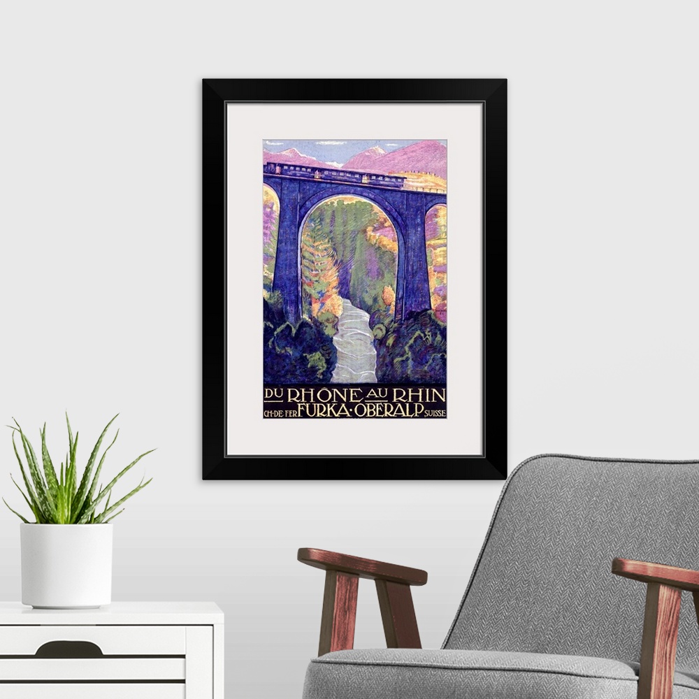 A modern room featuring Antiqued poster of a train riding across a tall bridge over a river with colored trees and mounta...