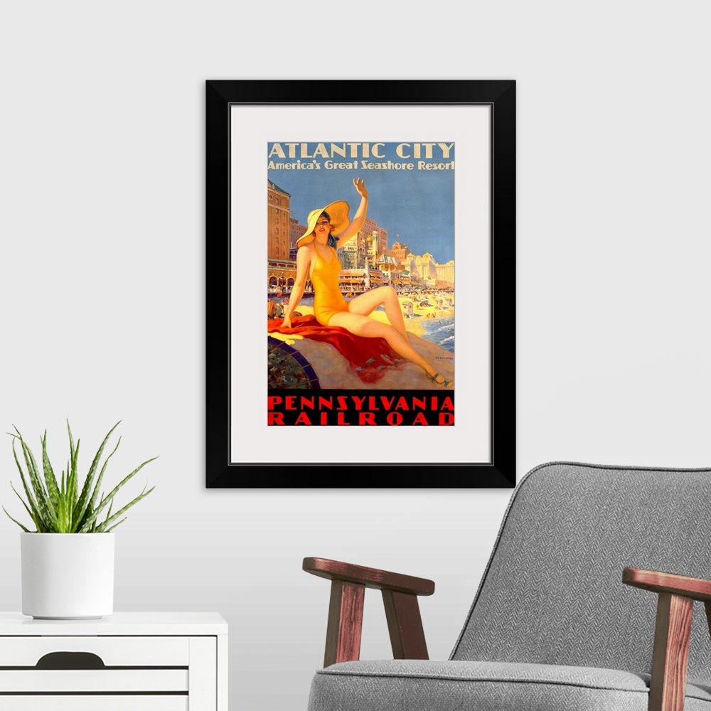 A modern room featuring Antique poster advertising beach resort.  A woman in a swimsuit and hat sits on a rock waving wit...