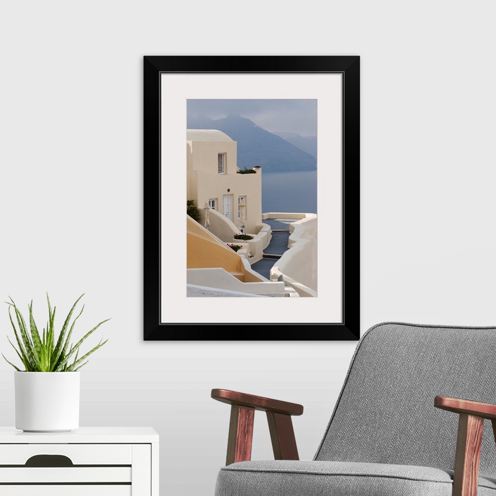 A modern room featuring Europe, Greece, Santorini, Thira, Oia. Pathway to end villa overlooking the sea.