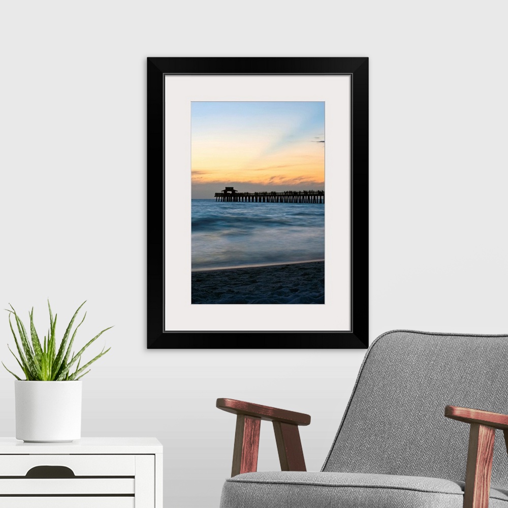 A modern room featuring Florida, Naples, beach and Naples Pier at sunset.