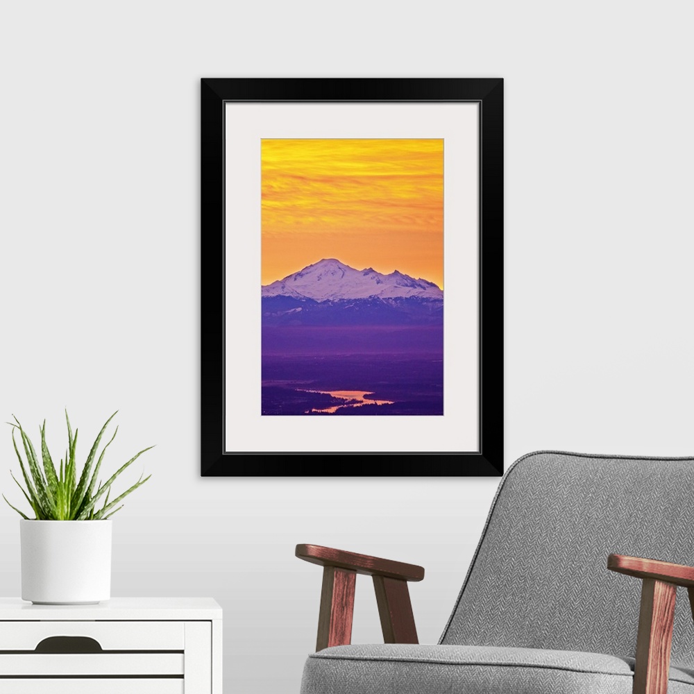 A modern room featuring Famous Mt.Baker volcano, located in  North Cascade Mountain Range dominates background while earl...