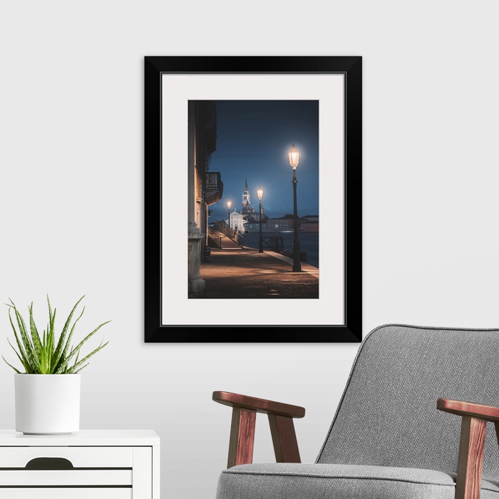 A modern room featuring Venice, Veneto, Italy. Riverside alley in Dorsoduro and San Giorgio church in the background at d...